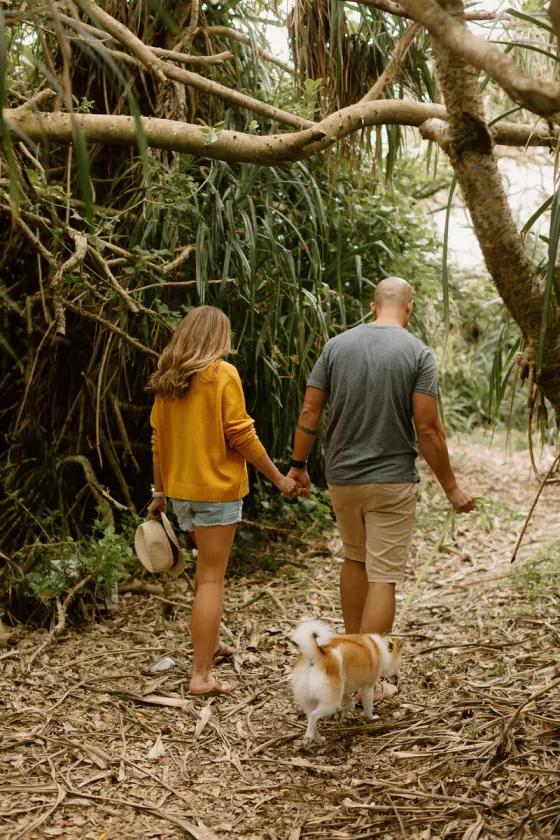 Couple walking together on a wooded path