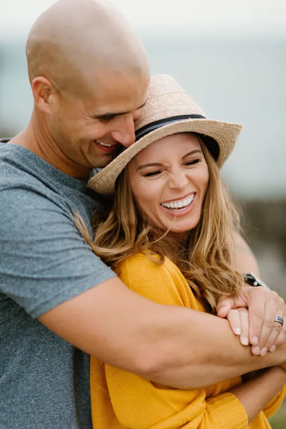 Couple laughing together outdoors