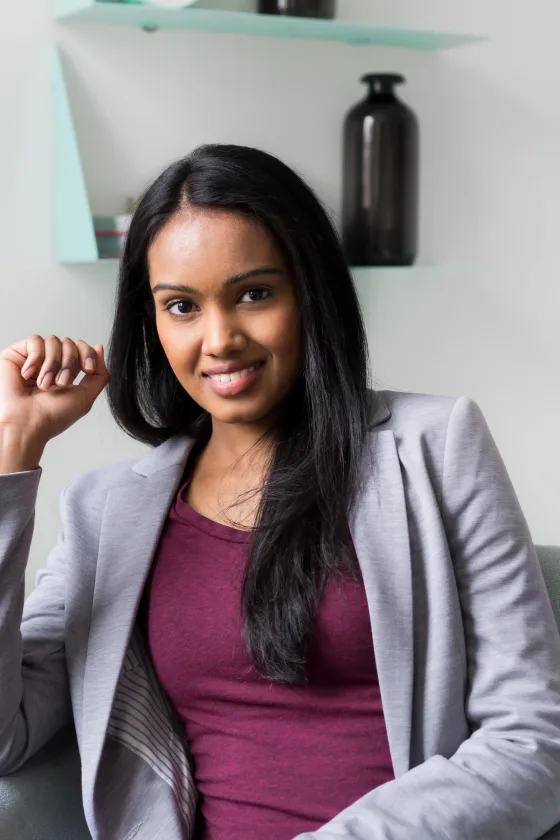 A smiling woman in a blazer